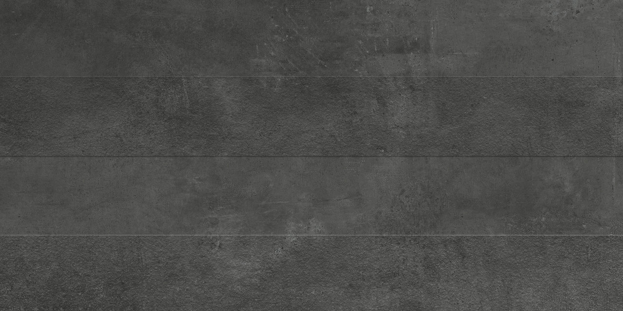 Piastrella in gres porcellanato grigio scuro effetto cemento.