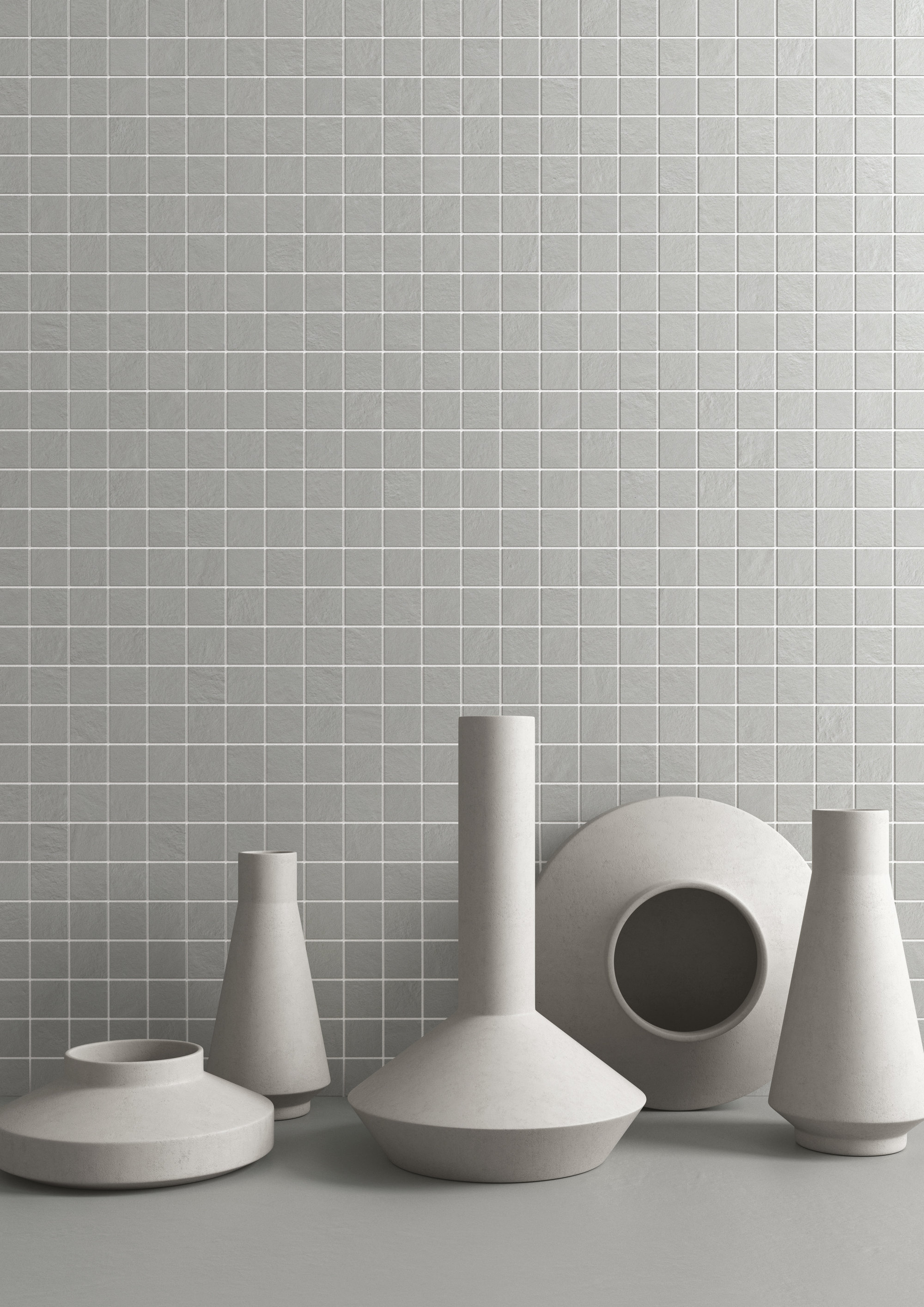 Hochwertige graue Wandfliesen im Gittermuster, stilvoll dekoriert.