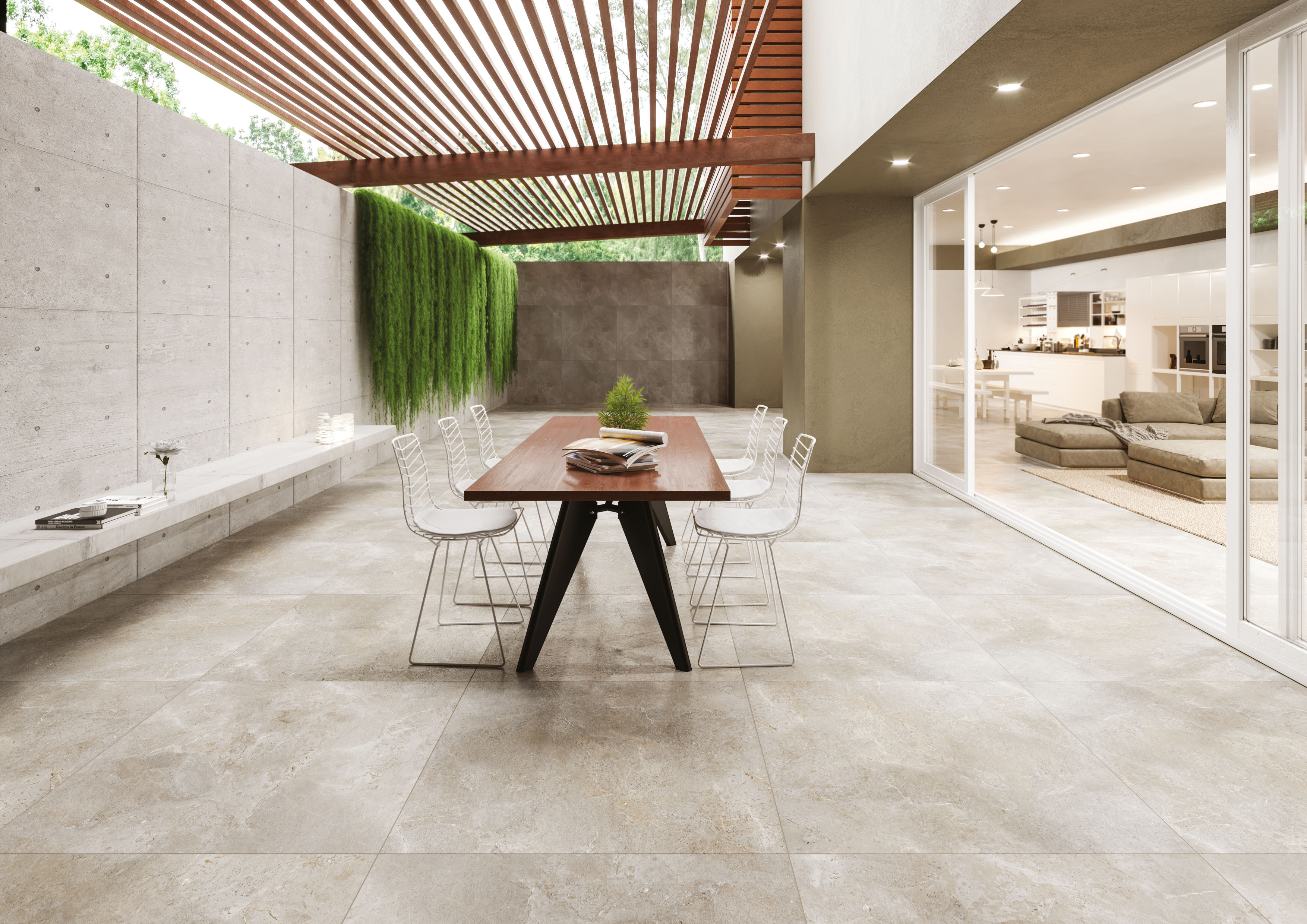 Helle Outdoor-Fliesen auf einer modernen Terrasse mit Essbereich und nahtlosem Übergang zum Wohnraum.